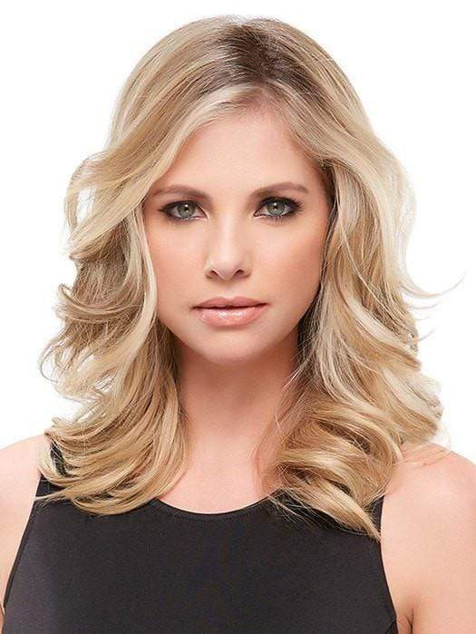 Styled with loose curls using a hot tool